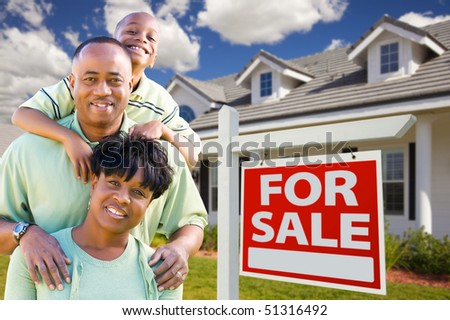 Happy and Attractive African American Family with For Sale Real Estate Sign and House.