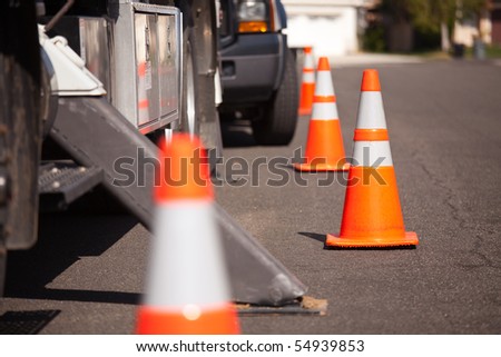 Several Orange Hazard Cones And Utility Truck In Street. Stock Photo ...