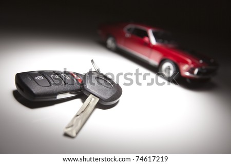 stock photo Car Keys and Sports Car Under Spot Light