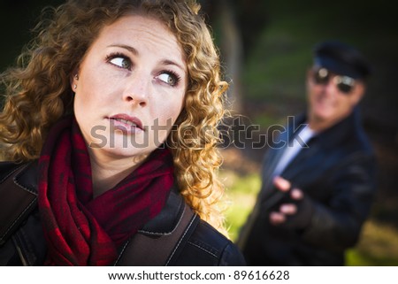 Pretty Young Teen Girl with Mysterious Strange Man Lurking Behind Her.