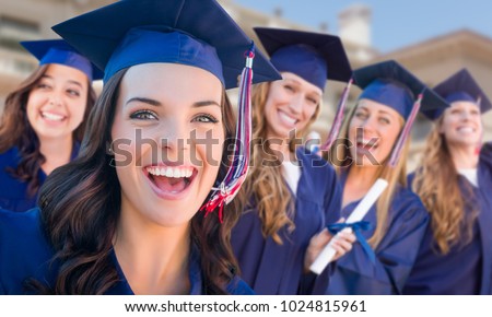 Happy Graduating Group of Girls In Cap and Gown Celebrating on Campus.