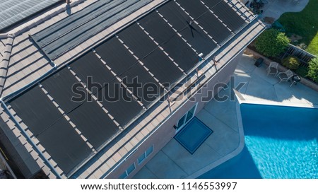 Thermal Solar Panels Installed on the Roof of a Large House.