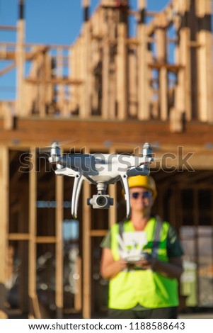 Female Pilot Flies Drone Quadcopter Inspecting Construction Site.