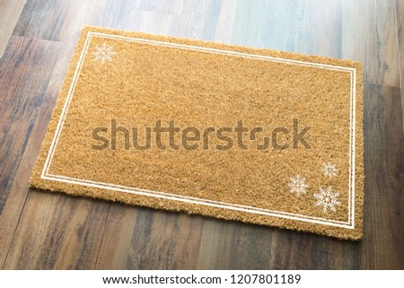 Blank Holiday Welcome Mat With Snow Flakes On Wood Floor Background.