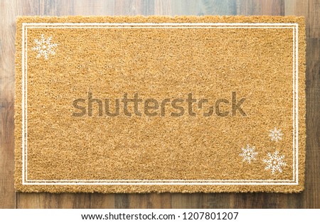 Blank Holiday Welcome Mat With Snow Flakes On Wood Floor Background.