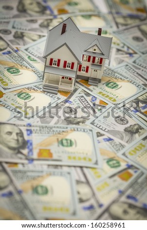 Small Model House on Newly Designed U.S. One Hundred Dollar Bills.