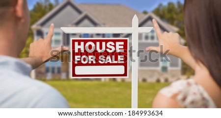 For Sale Real Estate Sign, House and Military Couple Framing Hands in Front.