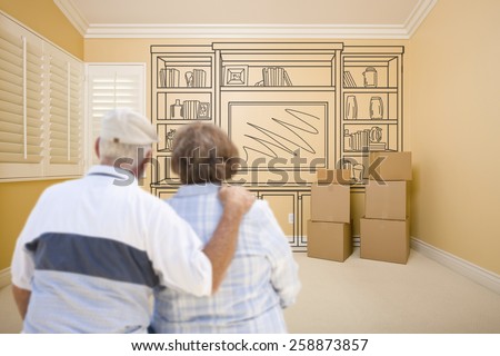 Hugging Senior Couple In Empty Room with Shelf Design Drawing on Wall.