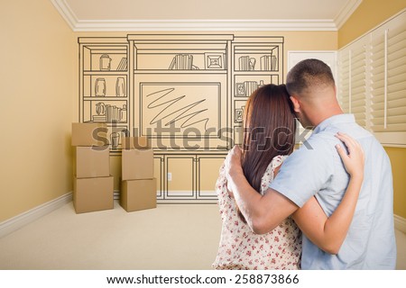 Hugging Military Couple In Empty Room with Shelf Design Drawing on Wall.