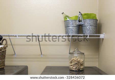 Abstract of Laundry Room with Buckets and Jar of Clothespins.