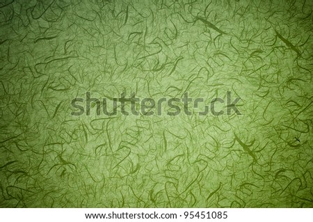 Green background with pattern and lens vignetting. (horizontal)