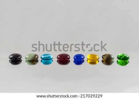 Arranged glass gems with blurred reflections