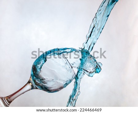 Interesting way for pouring blue drink in a glass