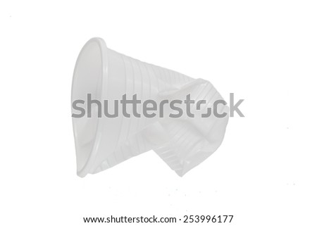 Crushed white plastic cup on a white background
