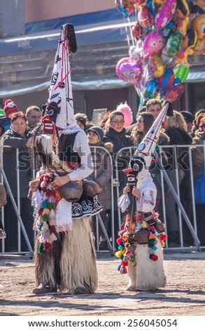 RAKITOVO, BULGARIA - FEBRUARY 14 - International festival of kuker's and masquerade games 14 February 2015 -  Bulgarian traditional dances and costumes called Kukeri