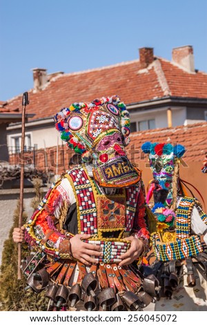 RAKITOVO, BULGARIA - FEBRUARY 14 - International festival of kuker\'s and masquerade games 14 February 2015 -  Bulgarian traditional dances and costumes called Kukeri