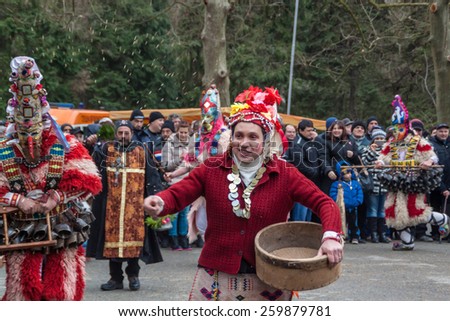 YAMBOL, BULGARIA - MARCH 08, 2015 - Kukerlandia - mask festival and masquerade games 08 March 2015. Bulgarian traditional dances and costumes called Kukeri.