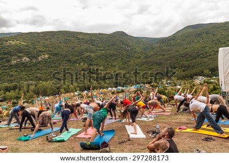KUKLEN, BULGARIA - JUJY 04, 2015 - Forest, music festival near Kuklen village, Bulgaria. People camping and participating in different activities like pottery, yoga, air yoga, handmade jewelry etc.
