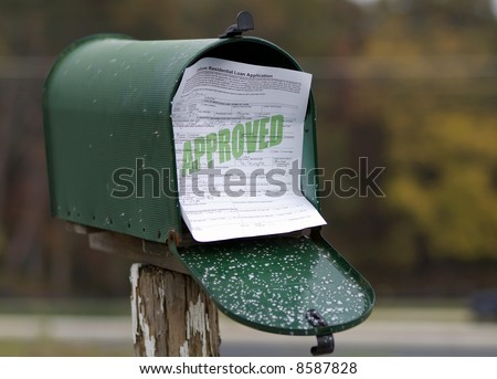 Approved residential loan application sticking out of mailbox.  All information is fictional.