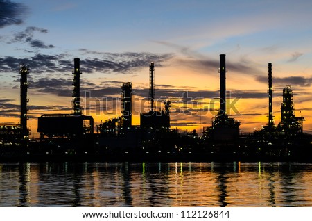 Oil refinery factory over sunrise Bangkok Thailand