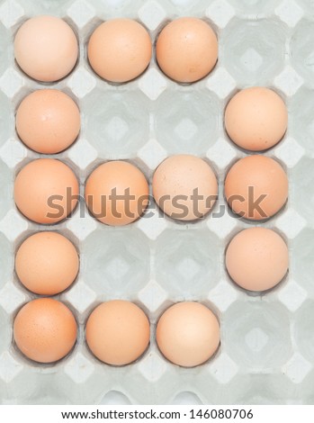 letter b  from the eggs,Eggs in paper tray isolated on white