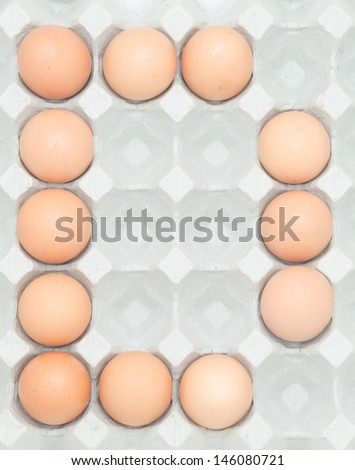 letter d  from the eggs,Eggs in paper tray isolated on white