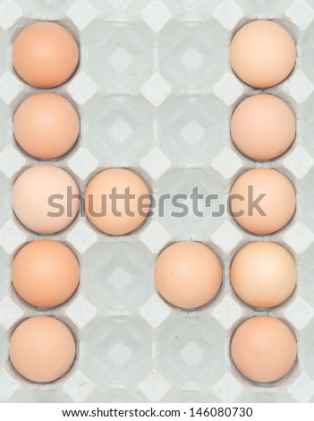 letter n  from the eggs,Eggs in paper tray isolated on white