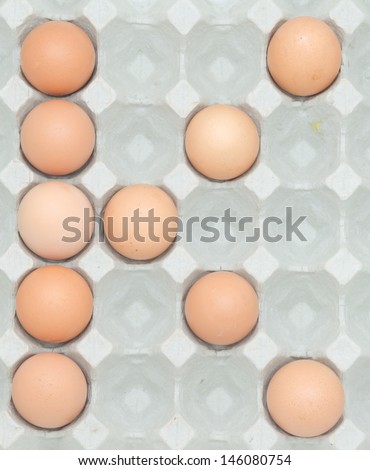 letter k  from the eggs,Eggs in paper tray isolated on white