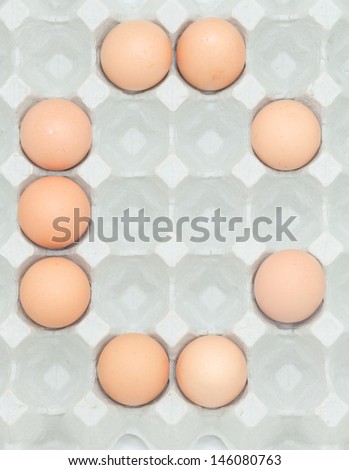letter c  from the eggs,Eggs in paper tray isolated on white