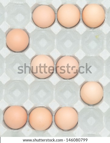 letter a  from the eggs,Eggs in paper tray isolated on white