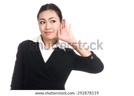 Young asian woman hand to ear trying to secretly listen in on a gossip conversation news with blank copy space area for text,Portrait of beautiful Asian woman,Thai girl,isolated on white background