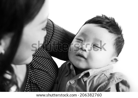 A close up of adorable baby sleeping in black and white image. Isolated on white background