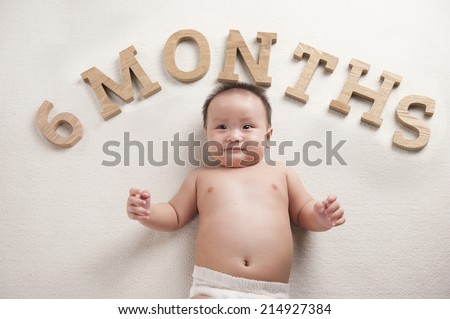 Close up of happy asia baby. Age concept. Six months years old child