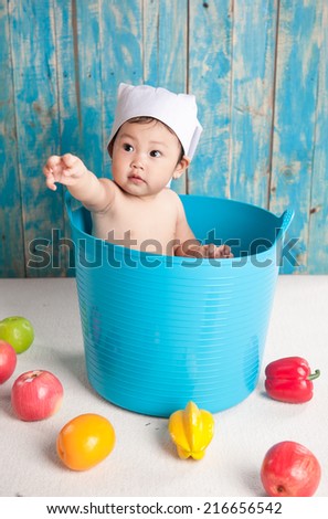Child and fresh fruit. Concept: healthy vegetable food diet make baby strong and happy