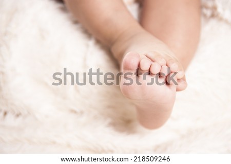 One year old child feet. cute baby feet