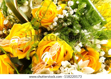 yellow rose for the san valentine day on the table with glass