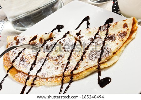 crepes with chocolate syrup