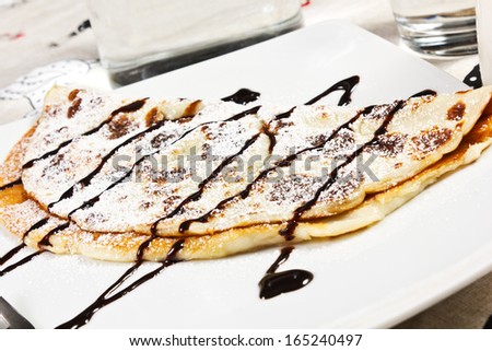 crepes with chocolate syrup