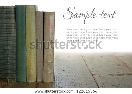 Green old books on wooden rustic background isolted on white