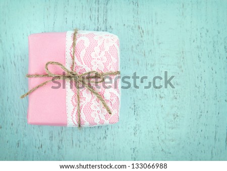 White Lace And A Simple Bow On Pink Gift Box On Light Blue Wooden Vintage Background - Concept For A Girl\'S Birthday Or For Mother\'S Day