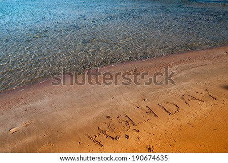 Inscription on the sand - holiday