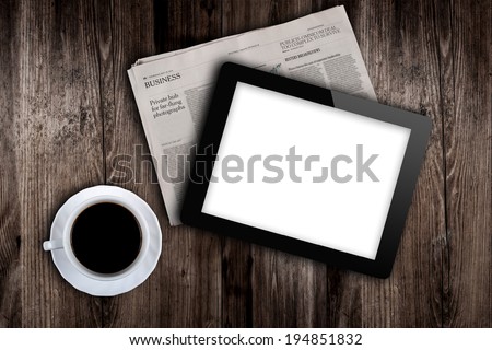 before work newspaper, coffee and tablet