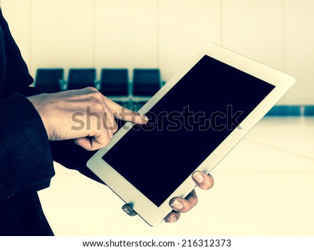 tablet in the hands of women before flight