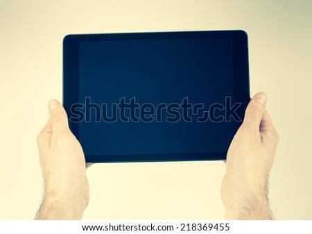 Vintage tablet in the hands of man