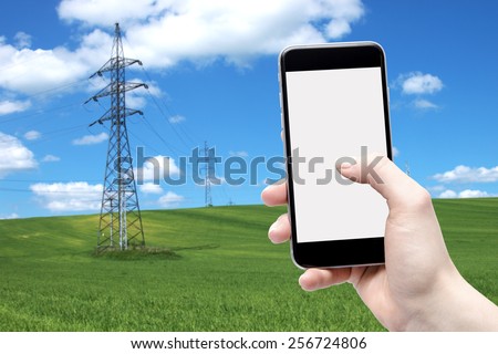 Telephone in the hands of women and against pylons