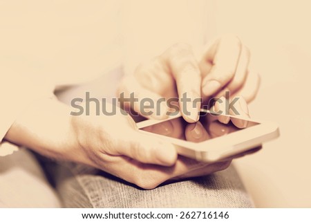 phone in the hands of a woman in the style of instagram