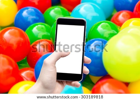 phone in the hand with a blank screen and a colorful background