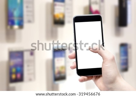 Woman checking shopping list on her smartphone at supermarket