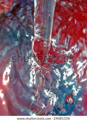 streem of water in red pail