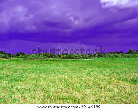 cocked field before thunderstorm